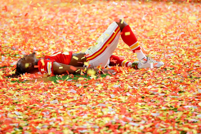 Confetti falls as Demarcus Robinson celebrates the Chiefs' Super Bowl victory