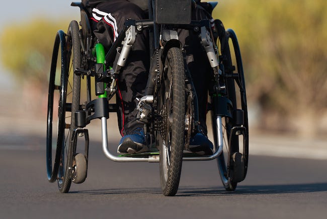Man in wheelchair during race