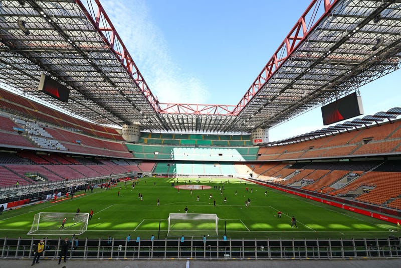 AC Milan and Genoa CFC players warm up in the empty stadium after rules to limit the spread of Covid-19 have been put in place before the Serie A match between AC Milan and Genoa CFC at Stadio Giuseppe Meazza (also known as the San Siro stadium) on March 8, 2020 in Milan, Italy.
