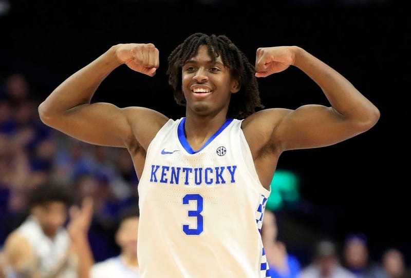 Tyrese Maxey flexes in celebration of play.