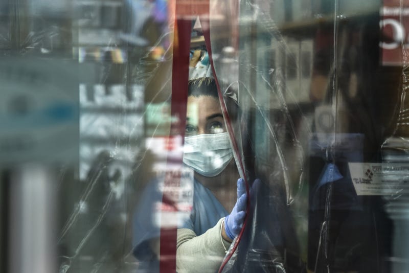 A pharmacist works while wearing personal protective equipment in the Elmhurst neighborhood on April 1, 2020 in New York City. With more than 75,000 confirmed cases of COVID-19 and more than 1,000 deaths, New York City has become the epicenter of the outbreak in the United States.