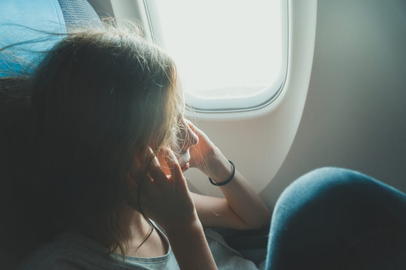 Woman Aggravated on Airplane