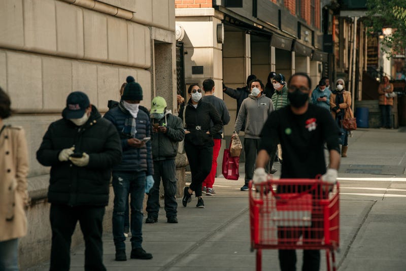 Shoppers stand in line apart from each other at a supermarket amidst calls for social distancing and a high demand for groceries on April 15, 2020 in the Cobble Hill neighborhood of the Brooklyn borough in New York City.