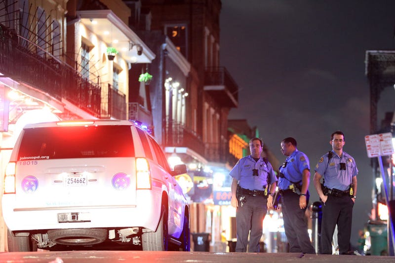 Members of the New Orleans Police Department stand on Bourbon Street