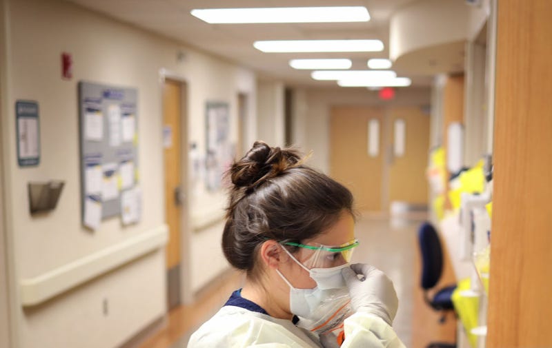 Nurses in the COVID-19 unit of MedStar St. Mary's Hospital check the fit of protective equipment before entering a patient's room March 24, 2020 in Leonardtown, Maryland.