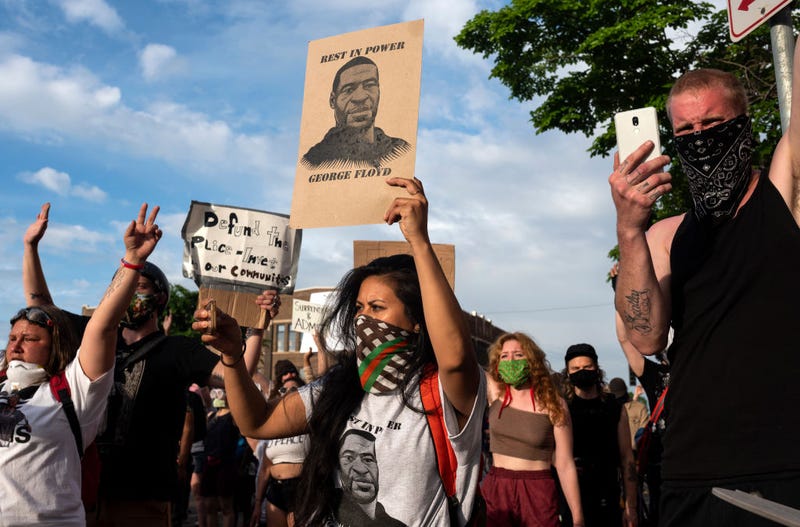 Protesters confront police outside the 3rd Police Precinct on May 27, 2020 in Minneapolis, Minnesota. Four Minneapolis police officers have been fired after a video taken by a bystander was posted on social media showing 46-year-old George Floyd's neck being pinned to the ground by an officer as he repeatedly said, "I can’t breathe". Floyd was later pronounced dead while in police custody after being transported to Hennepin County Medical Center.