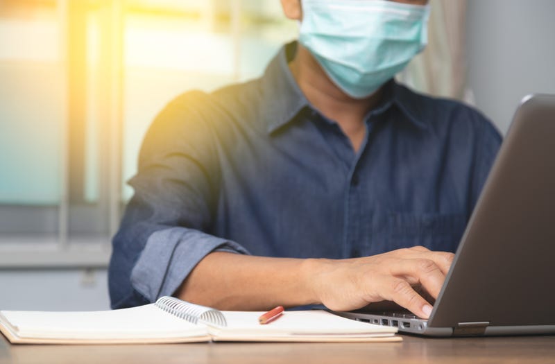 Male employee wearing a health mask