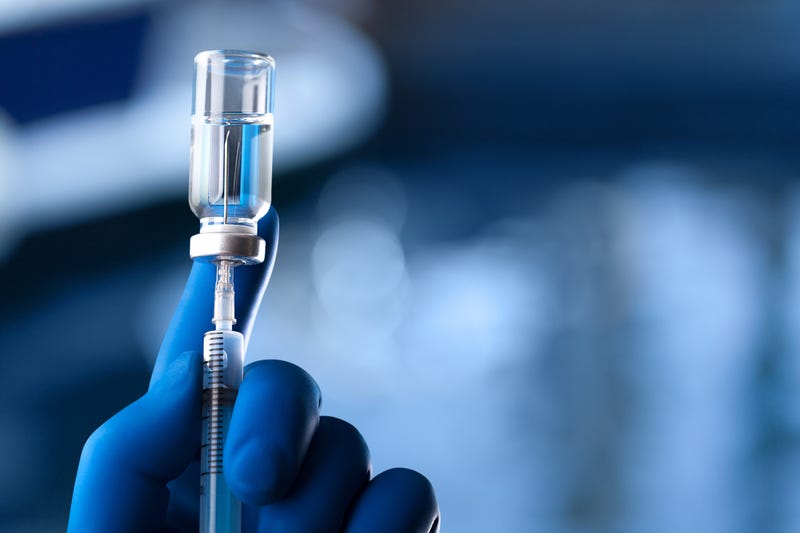 Vaccine syringe stock photo.