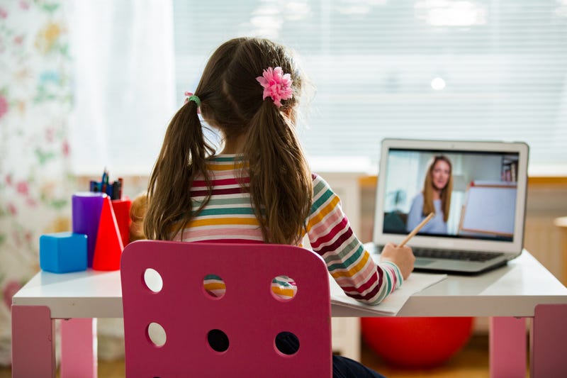 child using laptop for virtual class