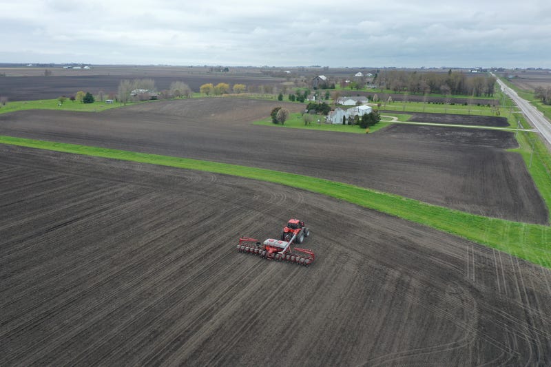 An aerial view from a drone shows John Duffy planting corn on a farm he farms with his father on April 23, 2020 near Dwight, Illinois.