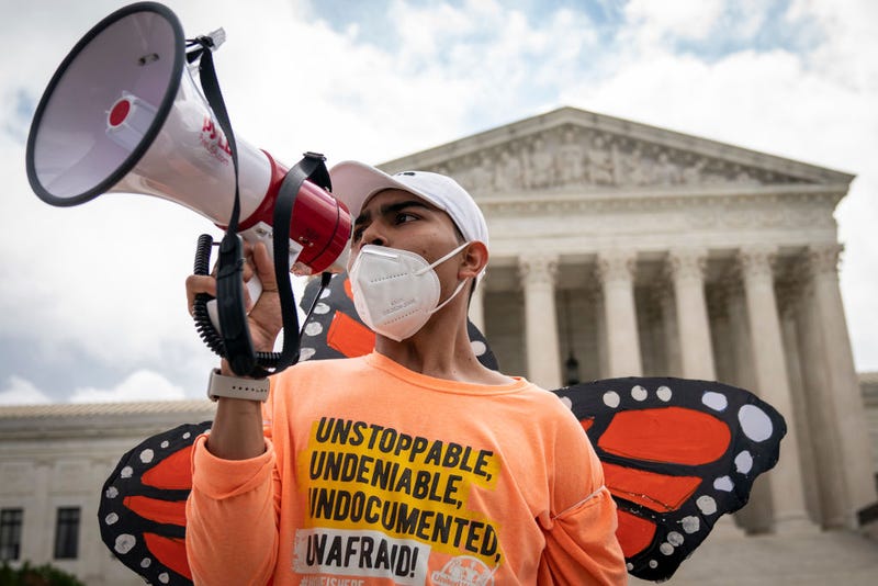 Roberto Martinez, a DACA recipient, chants and cheers following the Supreme Court's decision regarding the Trump administration's attempt to end DACA outside the U.S. Supreme Court on June 18, 2020 in Washington, DC.
