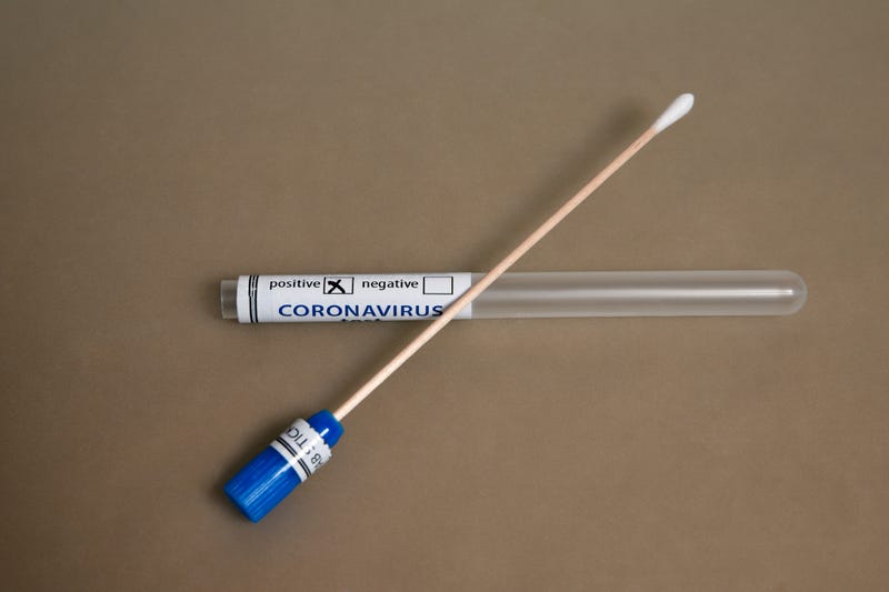 Sterile swab stick positive test of COVID-19 nCoV-2 Coronavirus on the table