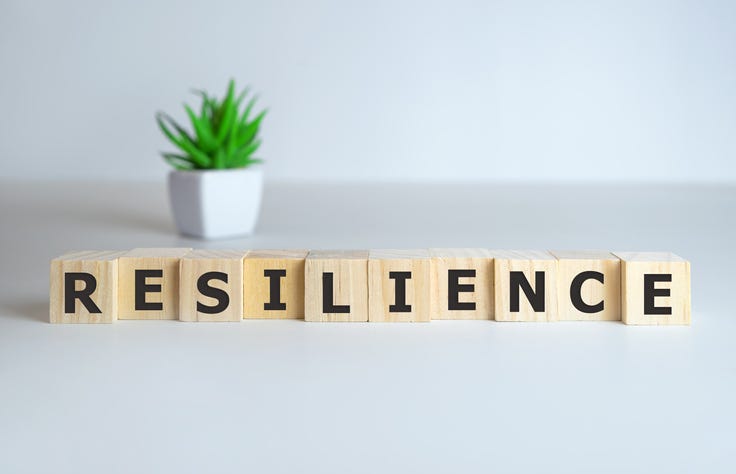 Resilience word concept on cubes