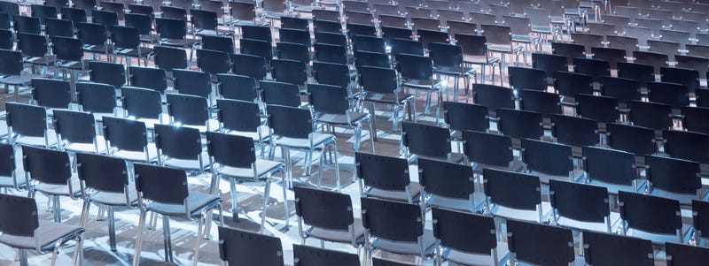 Empty seats. Equipped conference hall. Indoor business conference. Interior of a congress hall. Cancelled meetings, lectures, lessons, forums due to global disease. Online event. Web conference. - stock photo