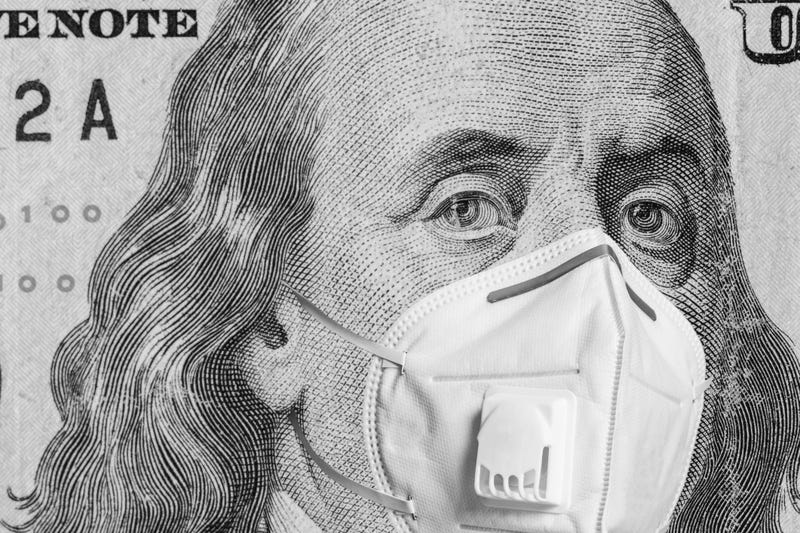 medical mask on american money