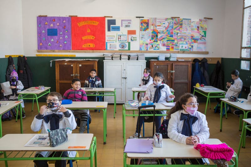 Students at the "Japon" public school number 72 attend class during the first day of the final phase of the gradual process to reopen schools on June 28, 2020 in Montevideo, Uruguay. Schools will impose strict social distancing measures and assistance is voluntary. Department of Treinta y Tres and border city of Rivera, postponed the return to school due to recent positive cases.