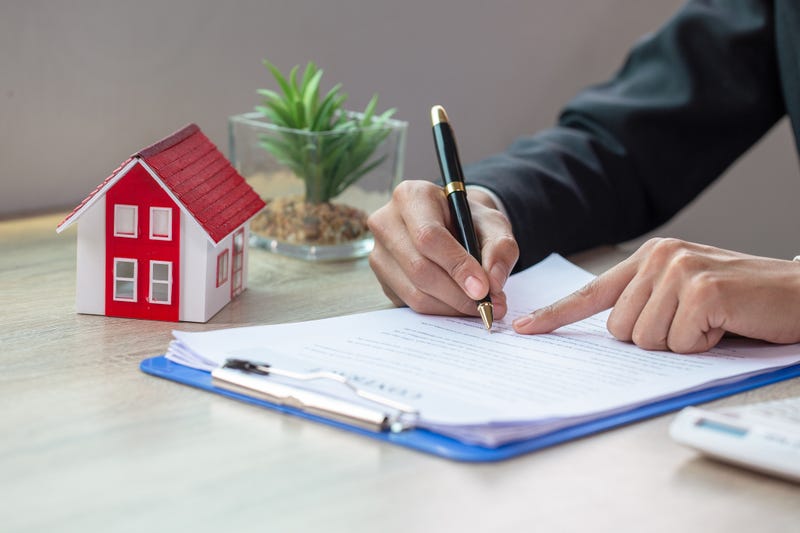 Little home next to person purchasing a house.