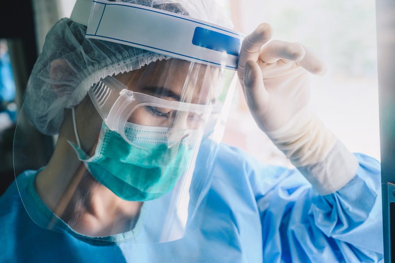 nurse with face mask and face shield
