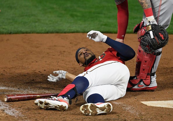 Byron Buxton on the ground after taking a pitch in the helmet