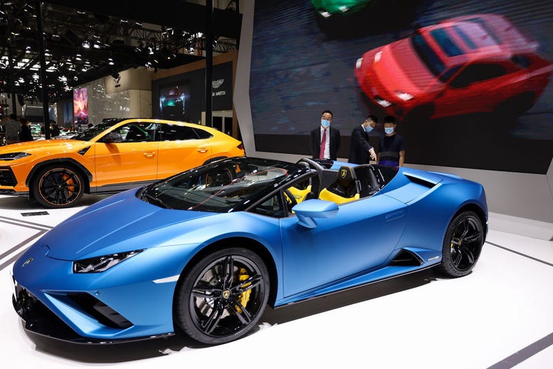 The potential consumers look at a Lamborghini car during 2020 Beijing International Automotive Exhibition at China International Exhibition Center on September 27, 2020, in Beijing.