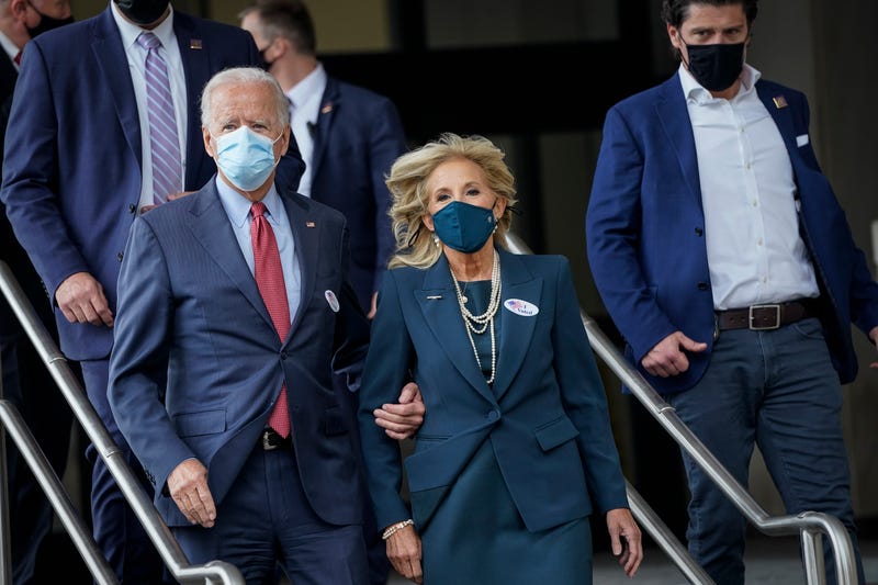 Democratic presidential nominee Joe Biden and his wife Dr. Jill Biden depart the Delaware State Building after casting their ballots for the general election on October 28, 2020 in Wilmington, Delaware.