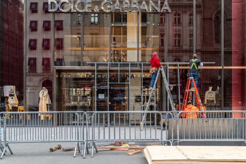 Carpenters board up a Dolce & Gabbana store located on 5th Avenue on November 1, 2020 in New York City.