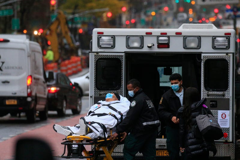 A patient is transported outside of Tisch Hospital in New York on November 13, 2020.