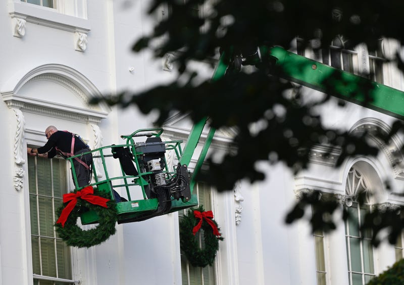 Christmas wreaths are installed at the White House in Washington, DC, on November 21, 2020.