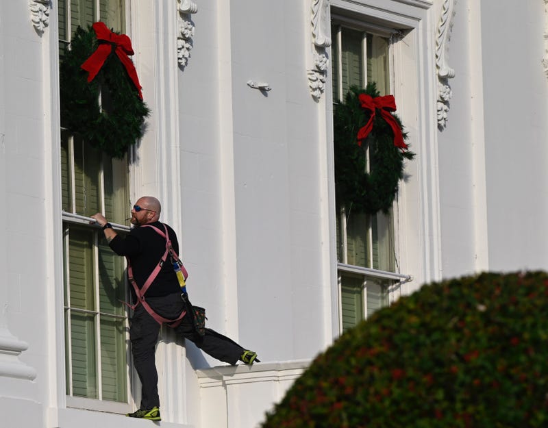 Christmas wreaths are installed at the White House in Washington, DC, on November 21, 2020.