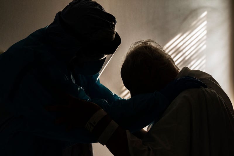 Doctor and patient hugging