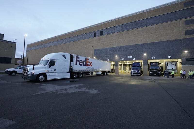 Boxes containing the Pfizer-BioNTech COVID-19 vaccine are prepared to be shipped at the Pfizer Global Supply Kalamazoo manufacturing plant on December 13, 2020 in Portage, Michigan.