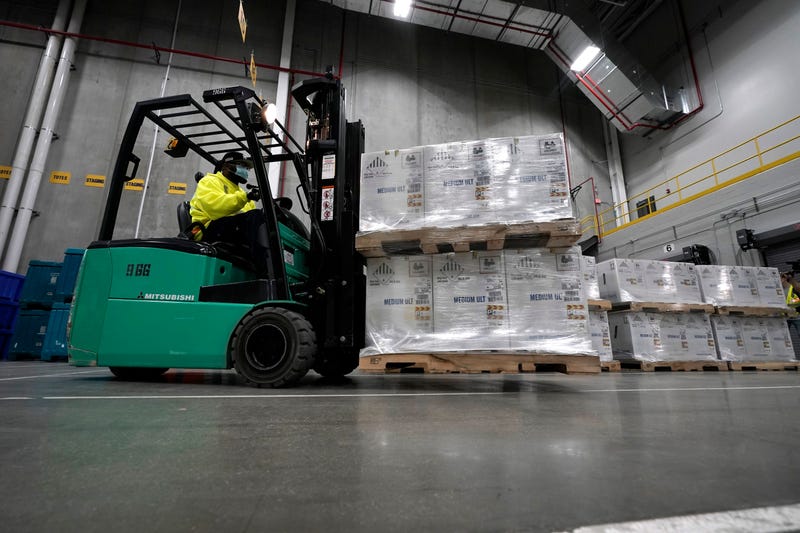 Boxes containing the Pfizer-BioNTech COVID-19 vaccine are prepared to be shipped at the Pfizer Global Supply Kalamazoo manufacturing plant on December 13, 2020 in Portage, Michigan.