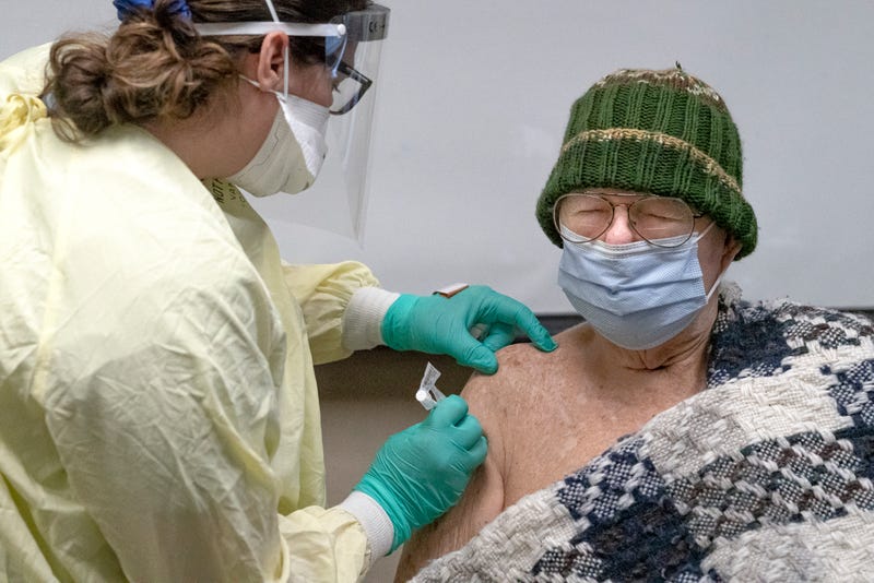 World War II Navy veteran Lawrence Doyle, 94, receives a COVID-19 vaccination at a Veterans Affairs long-term care facility on December 17, 2020 in Vancouver, Washington. Patients in long-term care facilities began receiving the Pfizer-BioNTech COVID-19 vaccine in Oregon this week.