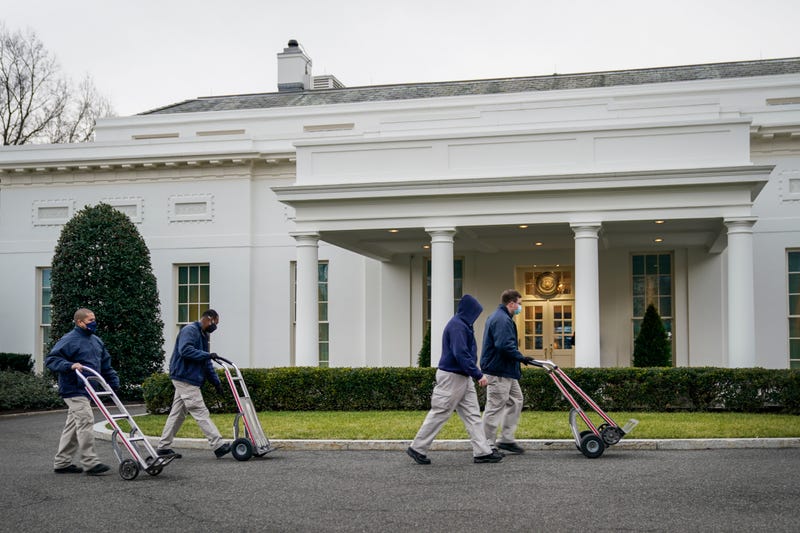 Workers roll dollies past the West Wing of the White House on January 15, 2021 in Washington, DC. According to recent news reports, President Donald Trump is slated to leave Washington the morning of Jan. 20th, hours before President-elect Joe Biden will be sworn-in as president.