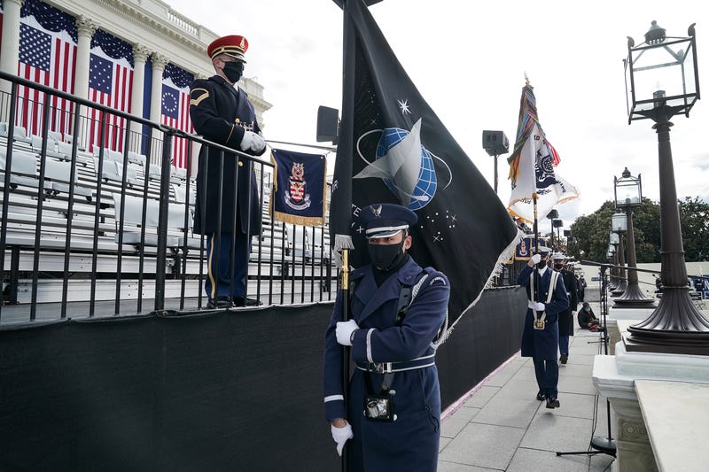 A member of the Air Force holds a Space Force flag in an honor guard during a dress rehearsal for the 59th inaugural ceremony for President-elect Joe Biden and Vice President-elect Kamala Harris at the U.S. Capitol on January 18, 2021 in Washington, DC.