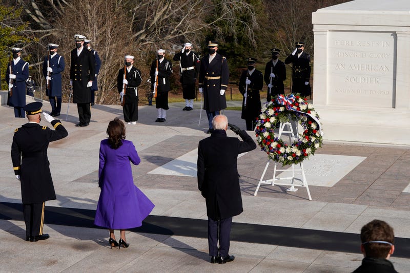 U.S. President Joe Biden (C), Vice President Kamala Harris, and Major General Omar J. Jones salute at the Tomb of the Unknown Soldier at the Arlington National Cemetery on January 20, 2021 in Arlington, Virginia. During today's inauguration ceremony Joe Biden became the 46th president of the United States.