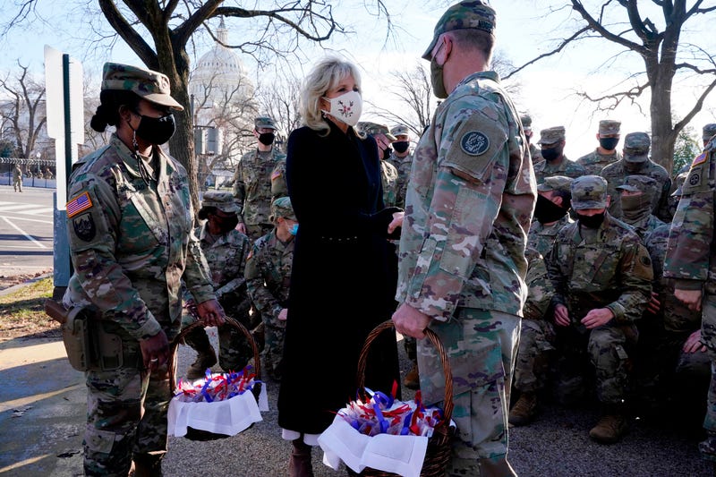 US First Lady Jill Biden surprises National Guard members outside the Capitol with chocolate chip cookies on January 22, 2021, in Washington, DC. 