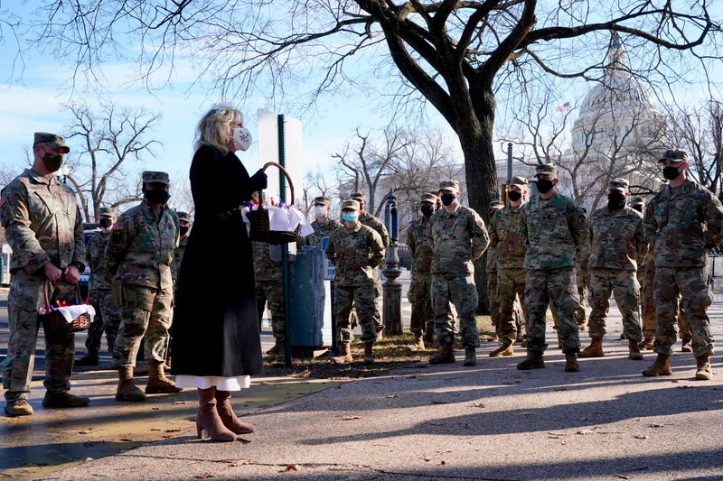 US First Lady Jill Biden surprises National Guard members outside the Capitol with chocolate chip cookies on January 22, 2021, in Washington, DC.