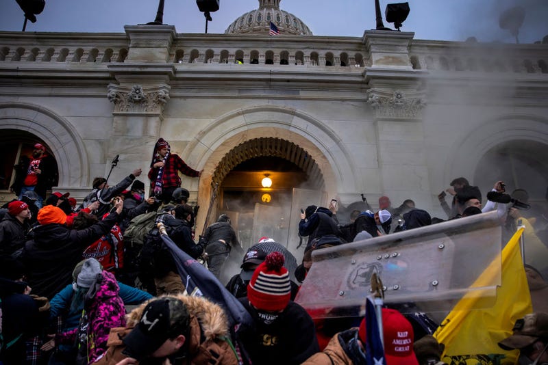 Trump supporters clash with police and security forces as people try to storm the US Capitol on January 6, 2021 in Washington, DC. - Demonstrators breeched security and entered the Capitol as Congress debated the 2020 presidential election Electoral Vote Certification. (photo by Brent Stirton/Getty Images)
