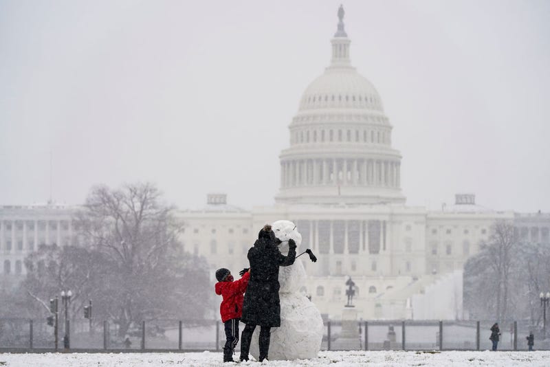 making a snowman at the National Mall