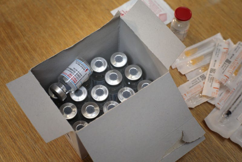 Moderna COVID-19 vaccine ampules sit in a box in the vaccination centre