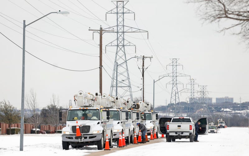 Pike Electric service trucks line up after a snow storm on February 16, 2021 in Fort Worth, Texas. Winter storm Uri has brought historic cold weather and power outages to Texas as storms have swept across 26 states with a mix of freezing temperatures and precipitation.