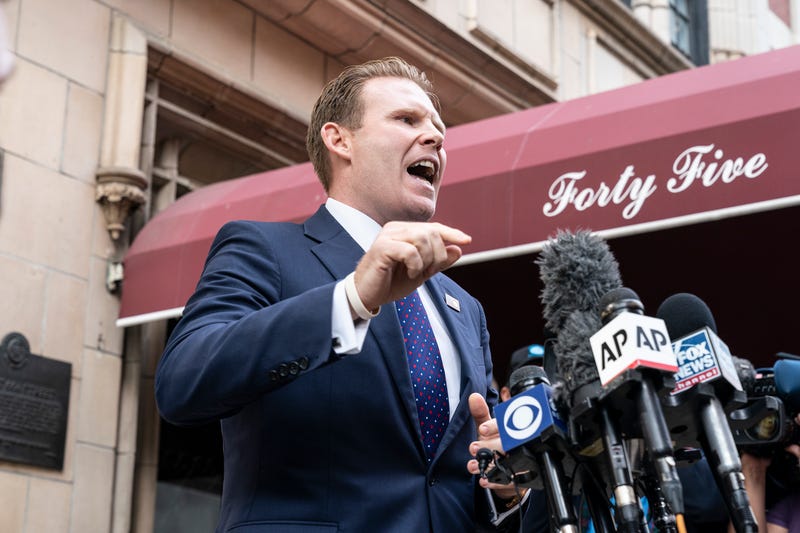 Andrew Giuliani addresses press outside of his father's apartment.