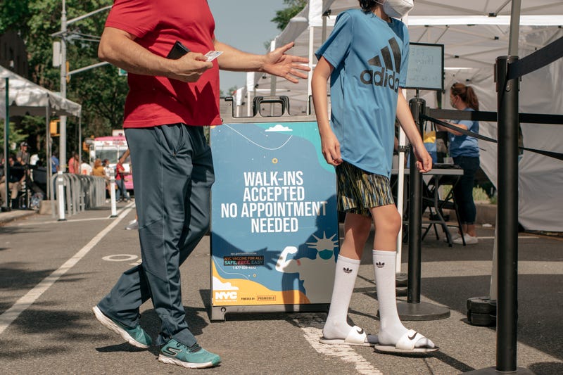 Families visit a pop-up COVID-19 vaccine site and block party on June 5, 2021 in the Jackson Heights neighborhood in the Queens borough in New York City