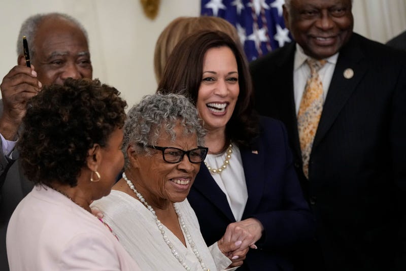94-year-old activist and retired educator Opal Lee, known as the Grandmother of Juneteenth, holds hands with Vice President Kamala Harris as U.S. President Joe Biden signs the Juneteenth National Independence Day Act into law in the East Room of the White House on June 17, 2021 in Washington, DC. The Juneteenth holiday marks the end of slavery in the United States and the Juneteenth National Independence Day will become the 12th legal federal holiday — the first new one since Martin Luther King Jr. Day was signed into law in 1983. (Photo by Drew Angerer/Getty Images)