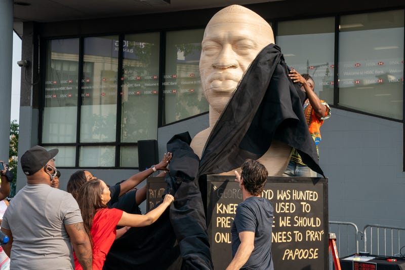 A statue of George Floyd is unveiled at Flatbush Junction on June 19, 2021, in the Brooklyn borough of New York City