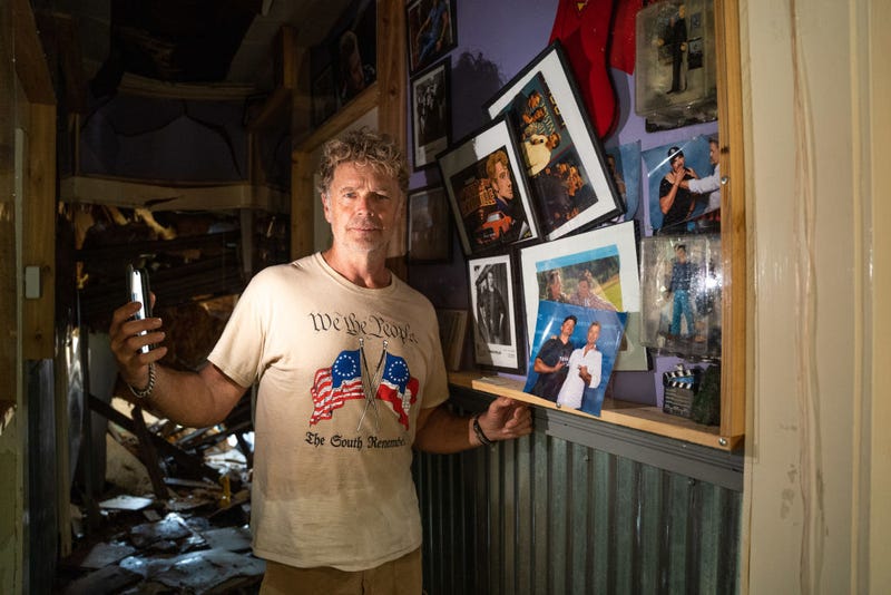 Actor John Schneider, known for his role as Bo Duke in "The Dukes of Hazzard" television series, stands inside his studio that was damaged by Hurricane Ida on September 2, 2021 in Holden, Louisiana