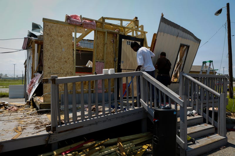 Debris is cleared at a collapsed car rental office after Hurricane Ida in Laplace, Louisiana, U.S., on Thursday, Sept. 2, 2021. The electric utility that serves New Orleans has restored power to a small section of the city after Hurricane Ida devastated the region's grid. Photographer: