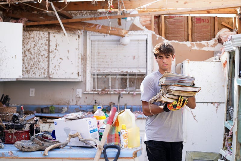 Michael Szeplaki helps to clean up his family's vacation house in the wake of Hurricane Ida on September 4, 2021 in Grand Isle, Louisiana. Ida made landfall as a Category 4 hurricane six days before in Louisiana and brought flooding, wind damage and power outages along the Gulf Coast. (Photo by Sean Rayford/Getty Images)