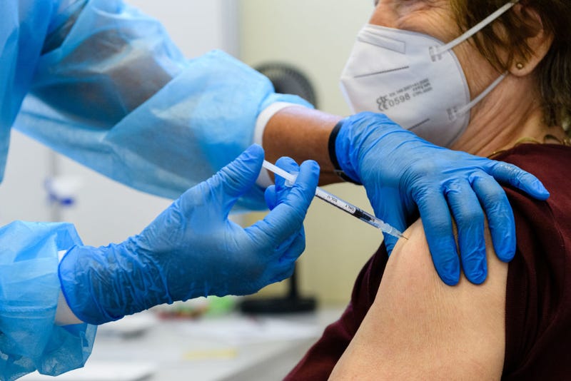 Medical staff member inoculates an elderly patient with a booster inoculation of the Pfizer/BioNTech vaccine against Covid-19 on September 15, 2021 in Erfurt, Germany. 